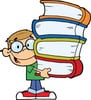 Happy student holding books in JFK Catholic School fourth grade classroom.