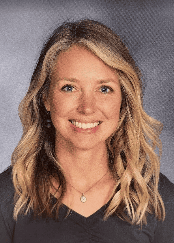 Portrait of Laura Corcoran, Choir & General Music Teacher at JFK Catholic School.