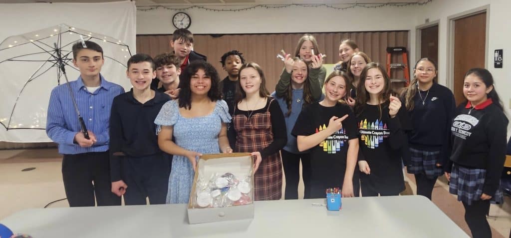 Students holding a project.