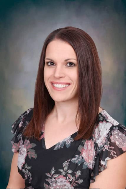Portrait of Sasha Lundquist, eighth grade teacher at JFK Catholic School.
