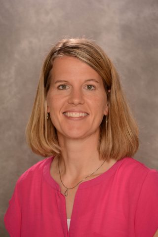 Portrait of Kathy Neuberger, Kindergarten teacher at JFK Catholic School, smiling.